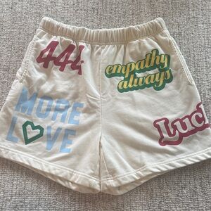 Empathy Always Cream Graphic Athletic Shorts